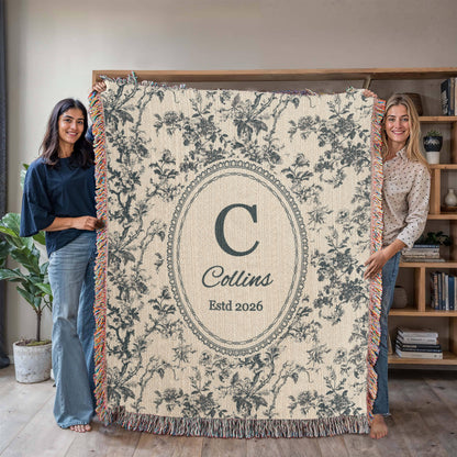 Personalized blue toile woven blanket with family initial, name, and established date