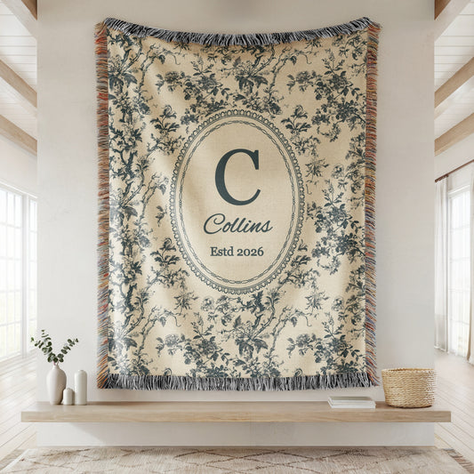 Personalized blue toile woven blanket with family initial, name, and established date