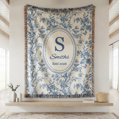Personalized blue toile woven blanket with family initial, name, and established date