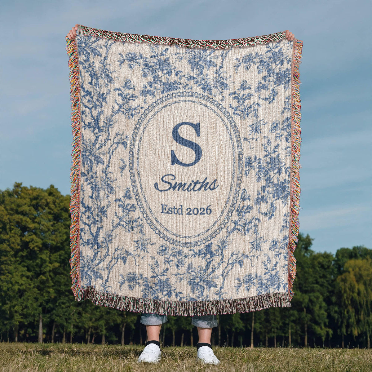Monogram family name throw blanket in an elegant French blue toile design